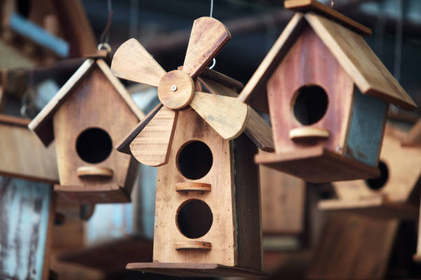 istock close up of hanging small wooden bird house 1094040726