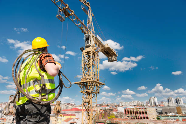 istock Manual Worker Wearing Hardhat And Reflective Clothing Working At Construction Site During Sunny Day 1094041670