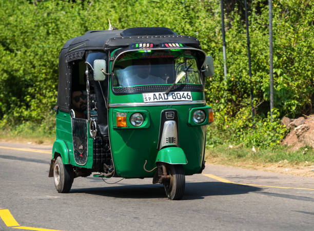 Tuk-tuk moto taxi on the street. Mirissa, Sri Lanka - January 07, 2017: Tuk-tuk moto taxi on the street. Famous thai moto-taxi called tuk-tuk is a landmark of the country and popular transport. taxi sri lanka stock pictures, royalty-free photos & images