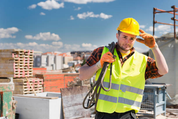 istock Manual Worker Wearing Hardhat And Reflective Clothing Working At Construction Site During Sunny Day 1094045862
