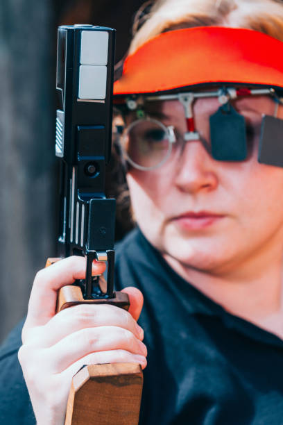 istock Close-Up Of Woman Practicing Target Shooting With Pistol 1094046386