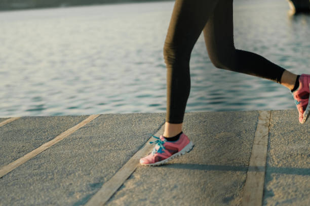 istock Woman running at beach 1094047806