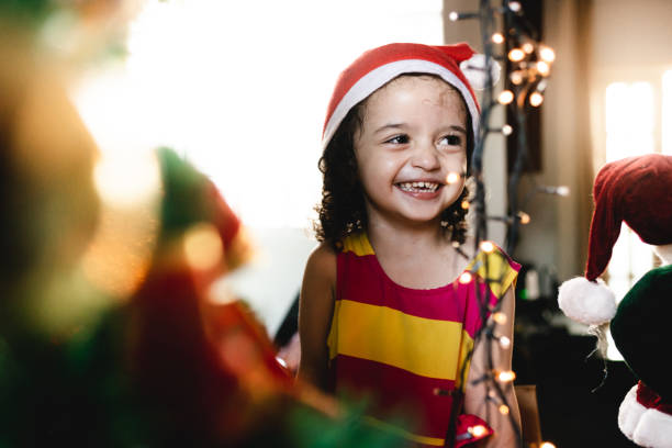 istock Little girl decorating the Christmas tree 1094053274
