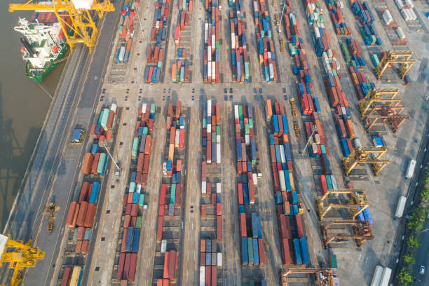 istock Logistics and transportation of Container Cargo ship and Cargo working crane bridge in shipyard 1094057820