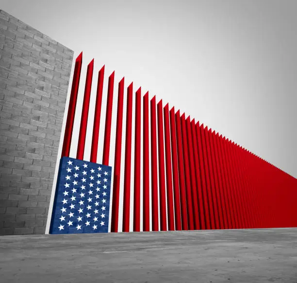 United States border wall and American immigration and USA refugee crisis concept as barrier or steel slat fence shaped as a US flag as a social issue about refugees or illegal immigrants as a 3D illustration.