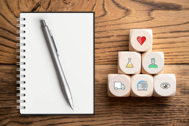 istock medical icons on cubes with empty note pad 1094066592