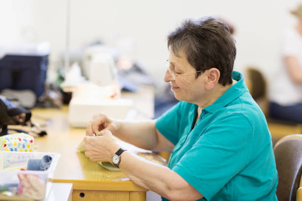istock Senior woman having a hobby: sewing 1094069062
