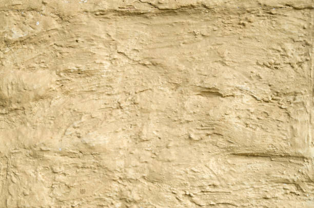 istock New decorative yellow  plaster closeup 1094073650