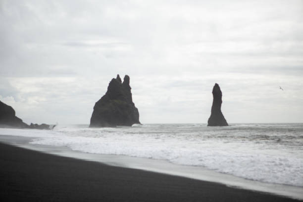 istock Iceland Reynisdrangar Sea Stacks at Vik on black sand beach 1094075010