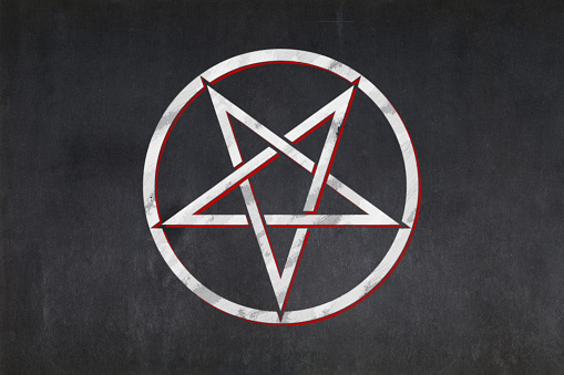 Blackboard with a the Inverted pentagram drawn in the middle.