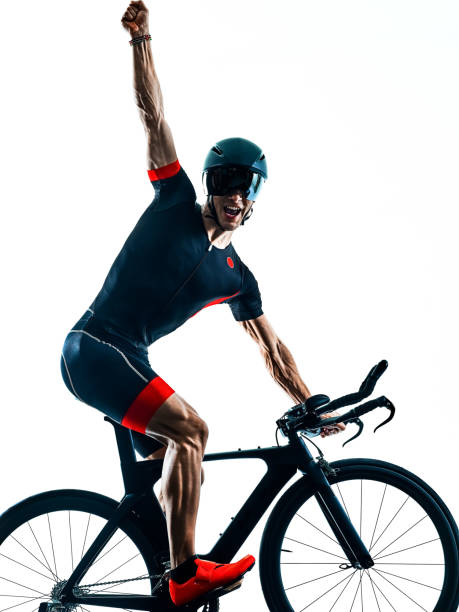 istock triathlete triathlon Cyclist cycling silhouette isolated white b 1094084034