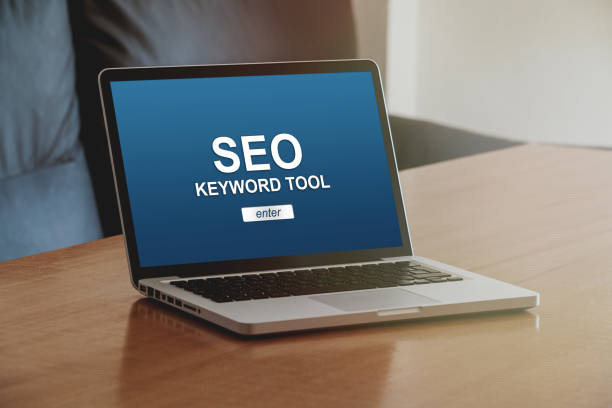 istock Laptop computer with SEO keyword tool in the screen. 1094085150