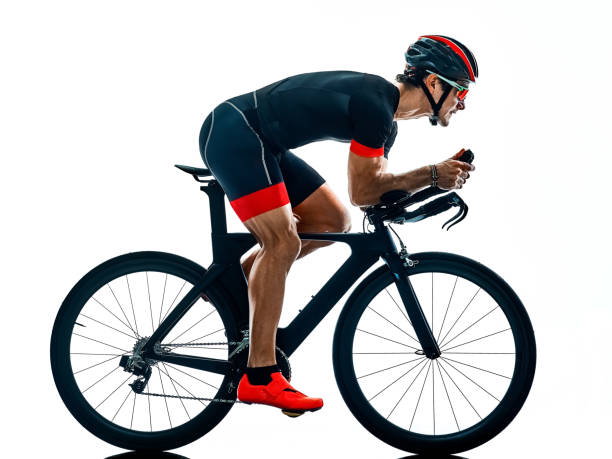 istock triathlete triathlon Cyclist cycling silhouette isolated white b 1094086112