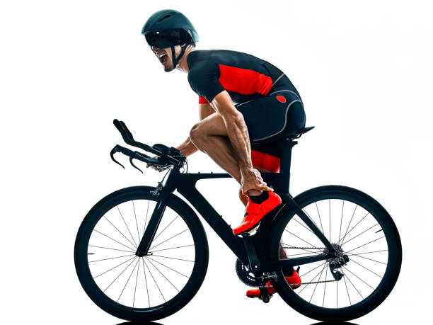 istock triathlete triathlon Cyclist cycling silhouette isolated white b 1094086434