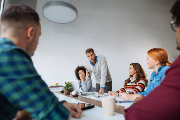 istock Multi racial group in business meeting, businessman explaining 1094094758
