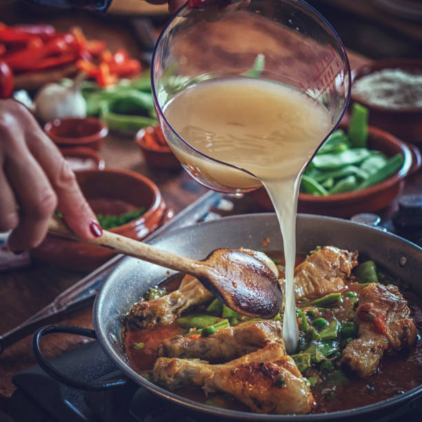 istock Preparing Chicken Paella with Green Beans, Peas and Paprika 1094100298