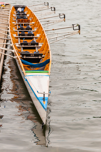 Close-up of an eight that is a rowing boat used in the sport of competitive rowing. It is designed for eight rowers, who propel the boat with sweep oars, and is steered by a coxswain, or cox.