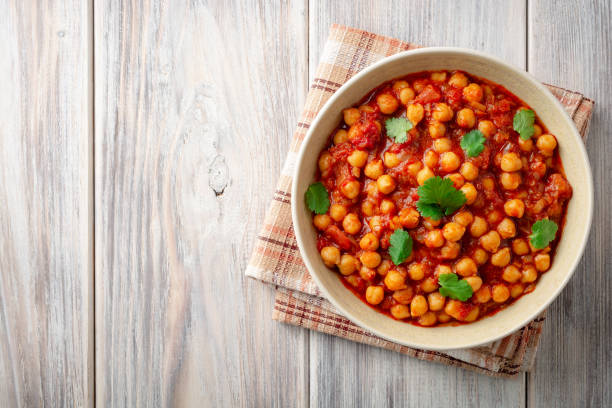 istock Spicy Chickpea curry Chana Masala in bowl on wooden table 1094101962
