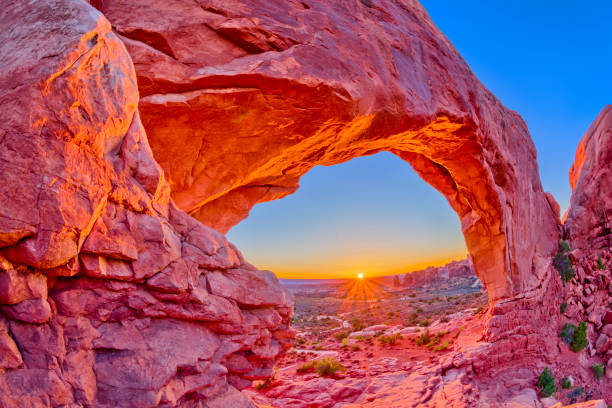 Arches National Park North Window Arch in the windows area of Arches National Park butte rocky outcrop photos stock pictures, royalty-free photos & images