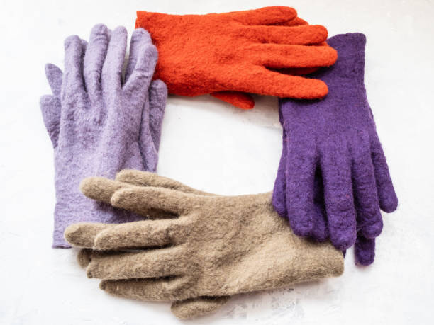 istock frame from new felted gloves on gray 1094103698
