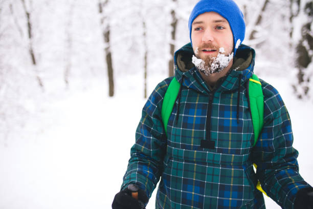 istock Man Traveler walking alone snow mountains. 1094103744