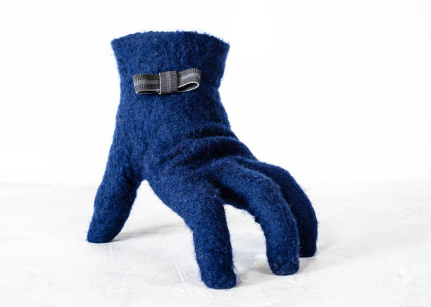 istock felted glove with bow tie stands on gray board 1094103768