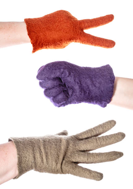 istock hands in colour gloves show rock-paper-scissors 1094103798