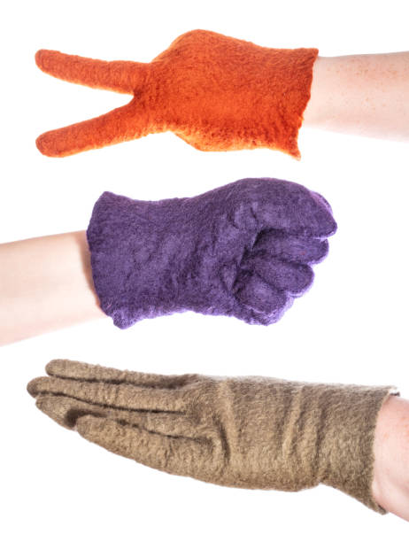 istock hands in felted gloves show rock-paper-scissors 1094103806