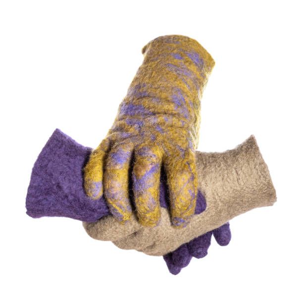 istock felted glove covers handshake of colored gloves 1094103834