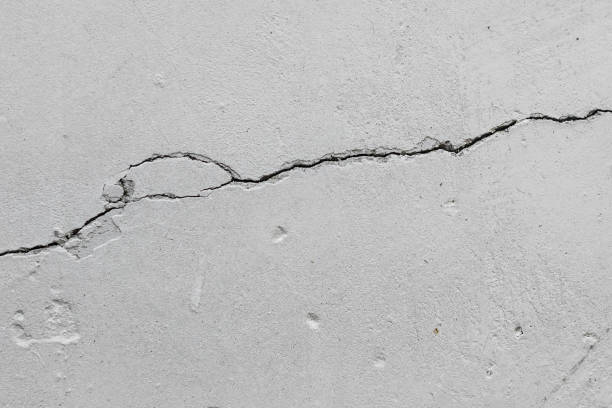 istock crack in an old concrete wall 1094103872