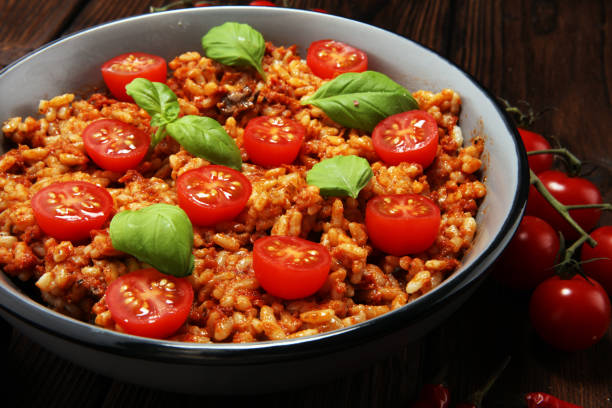 risotto with tomatoes, fresh herbs and parmesan cheese and basil
