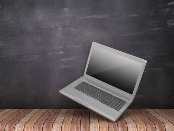 istock Computer Laptop on Wood Floor - Chalkboard Background - 3D Rendering 1094108588