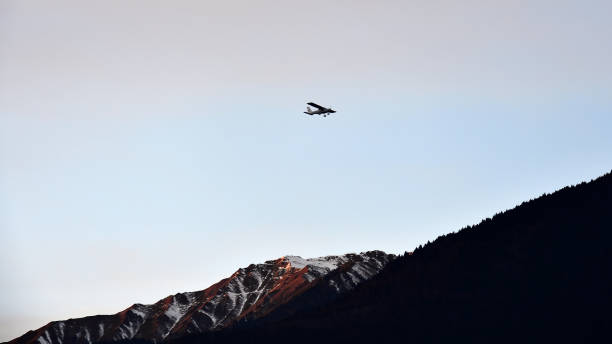 Flying over the Orobian Alps. Picture of an airplane flying over the Orobian Alps in Valtellina ultralight stock pictures, royalty-free photos & images