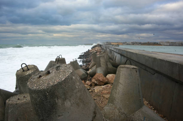 istock Concrete breakwater in stormy se 1094109098