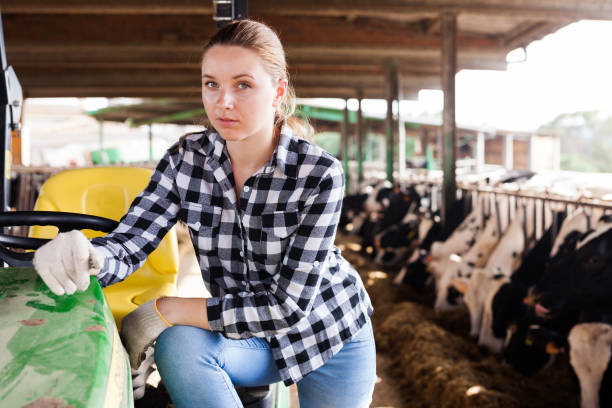 istock Female farmer working on tractor 1094118802