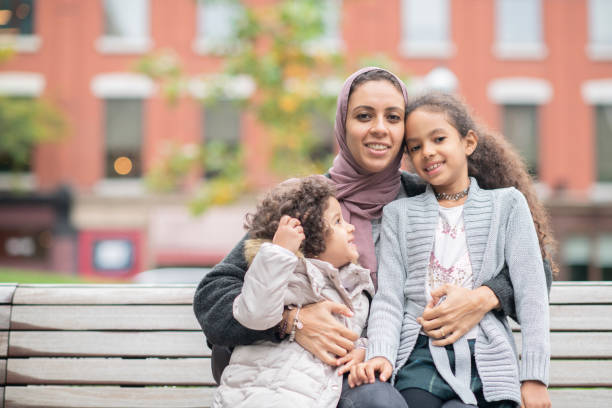 istock Mother holding her two children 1094120262