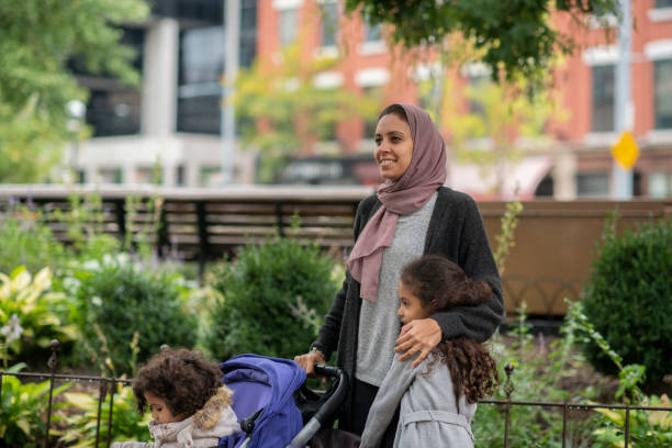 istock Mother walking with her children 1094120276