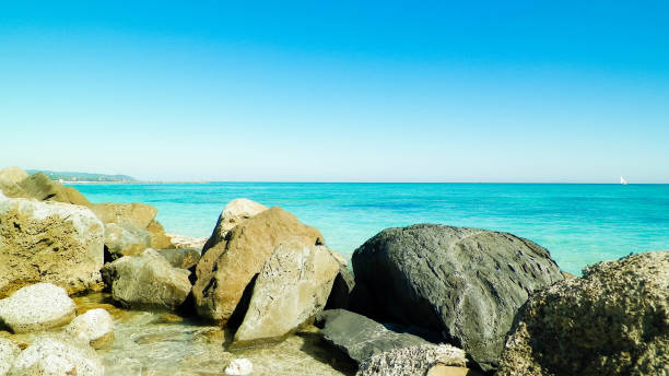 istock Stones on beach in Vada, Italy. 1094120990