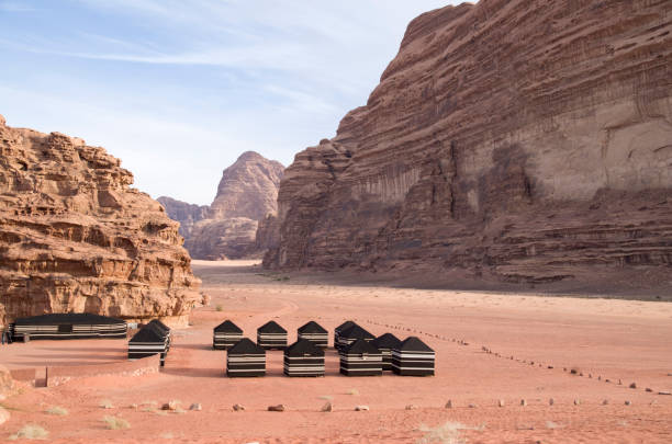 Bedouin tourist black tents in the Wadi Rum desert in Jordan Bedouin tourist black tents in the Wadi Rum desert in Jordan bedouin photos stock pictures, royalty-free photos & images