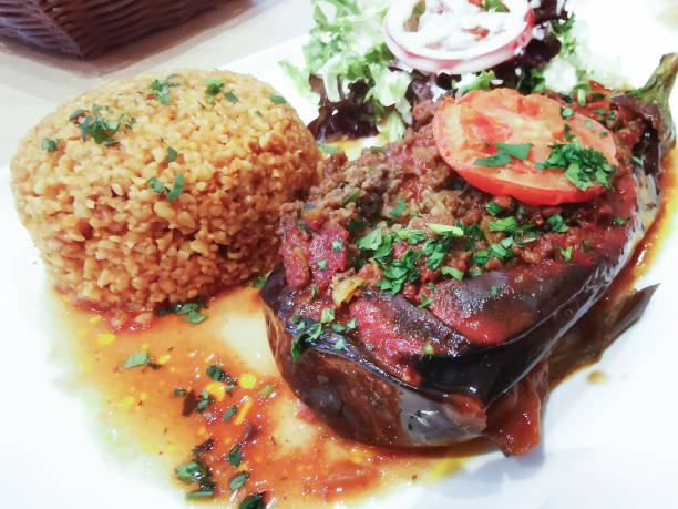 istock Traditional Mediterranean recipe made with stuffed eggplant, fresh lettuce and bulgur. 1094123466