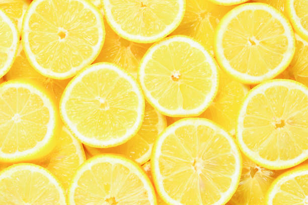 istock A slices of fresh juicy yellow lemons.  Texture background, pattern. 1094125974