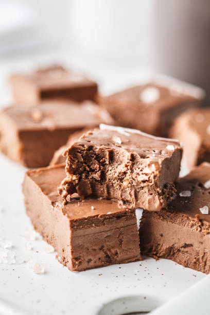 istock Raw vegan chocolate fudge on a white board. 1094128476