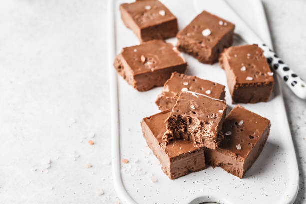 istock Raw vegan chocolate fudge on a white board, copy space. 1094128502