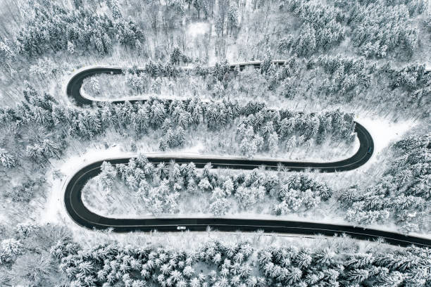 istock Severe weather conditions on road in winter time 1094128820