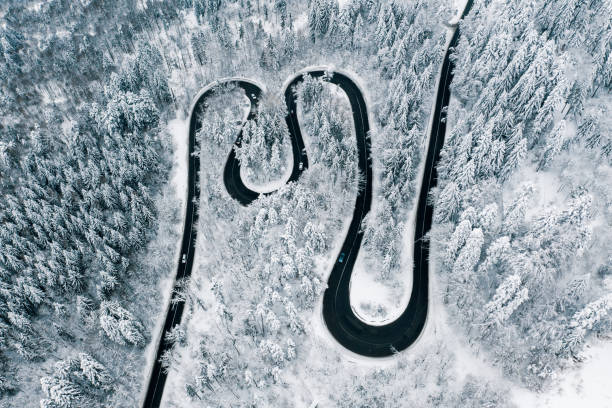istock Highway trough the snow in the mountains 1094129408