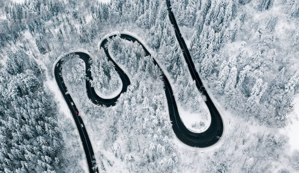 istock Winding road in winter conditions 1094129432