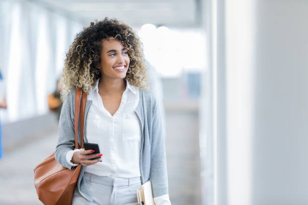 istock Cheerful businesswoman walking to work 1094130274