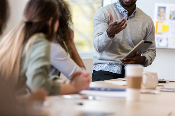 istock Unrecognizable business manager speaks during team meeting 1094131624