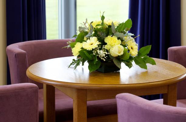 Funeral Directors office with flowers Reception area with floral display and seating in a Funeral directors funeral planning stock pictures, royalty-free photos & images