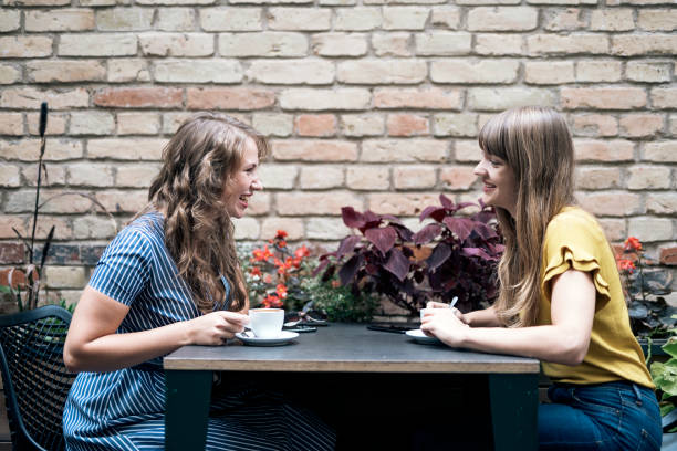 istock Relaxing women enjoying coffee together 1094136942